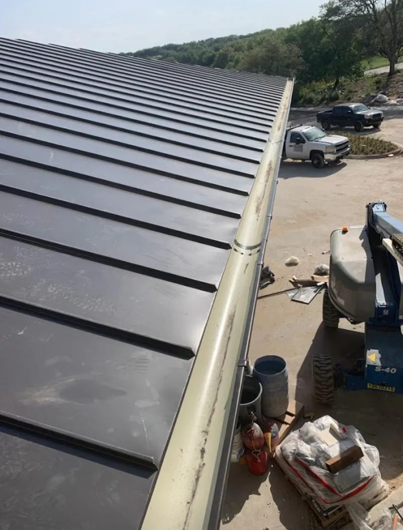 Standing seam panel and gutter detail on a metal roofing jobsite in Wyoming